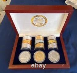 3-Plated Rolls of Kennedy Half Dollars from The World Reserve Monetary Exchange