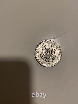 Rare 1974 Kennedy half dollar coin (no mint mark, circulated)